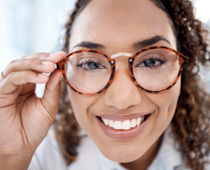 Black woman, face closeup and glasses for eye care, vision and designer frame, prescription lens an.