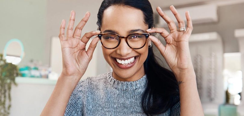 Patient trying on new eyeglasses at The Eye Care Center before year-end FSA and vision benefits expire