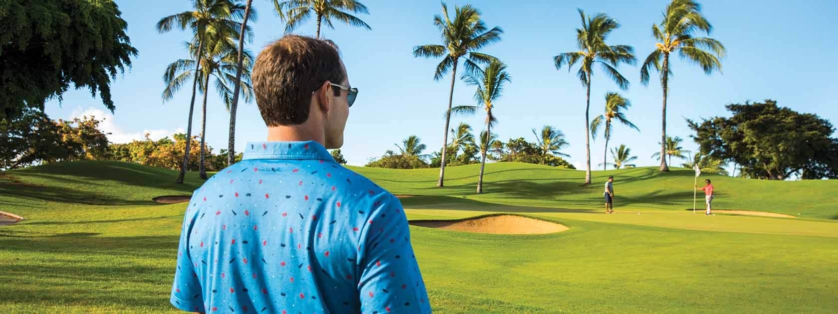 Polarized Golf Sunglasses for Chicagoland Golfers Golfer on a Chicagoland course in autumn wearing polarized wraparound golf sunglasses as low sun reflects off a water hazard
